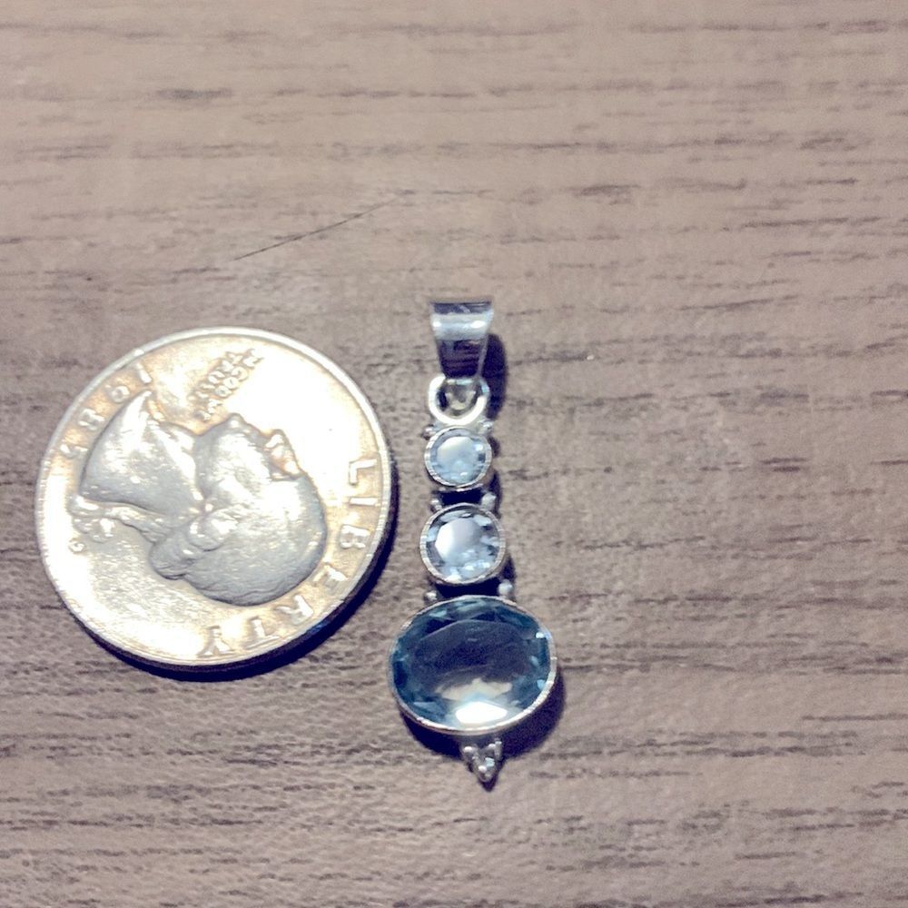 Beautiful sterling silver blue topaz pendant.